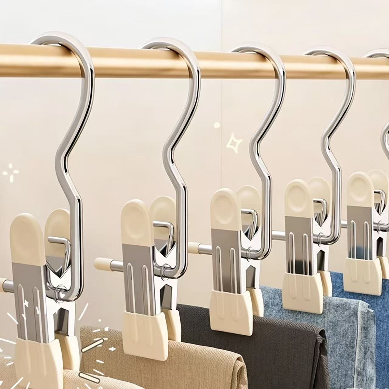 JEREMYTIS hanger clips hanging pants, clothes, and small items on a closet rod