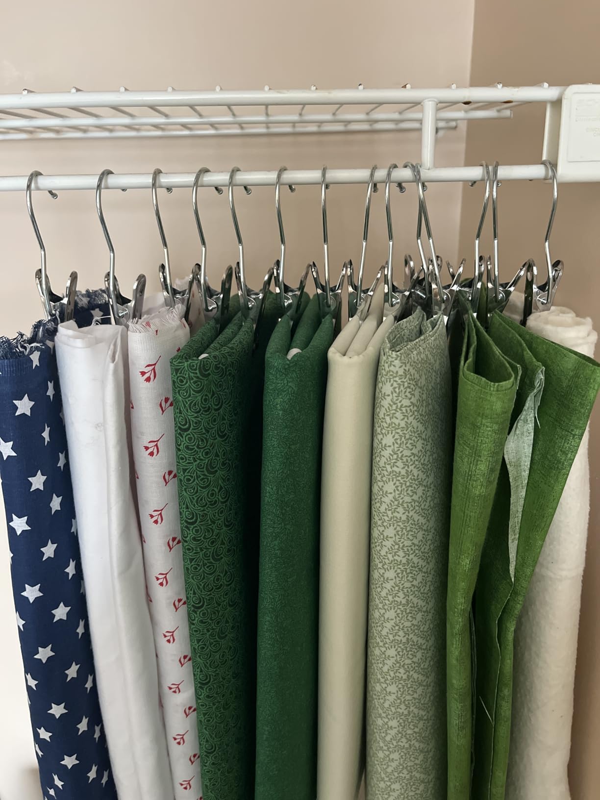 Fabric pieces hanging neatly with metal clip hangers