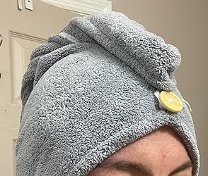 Customer close-up wearing grey microfiber hair cap