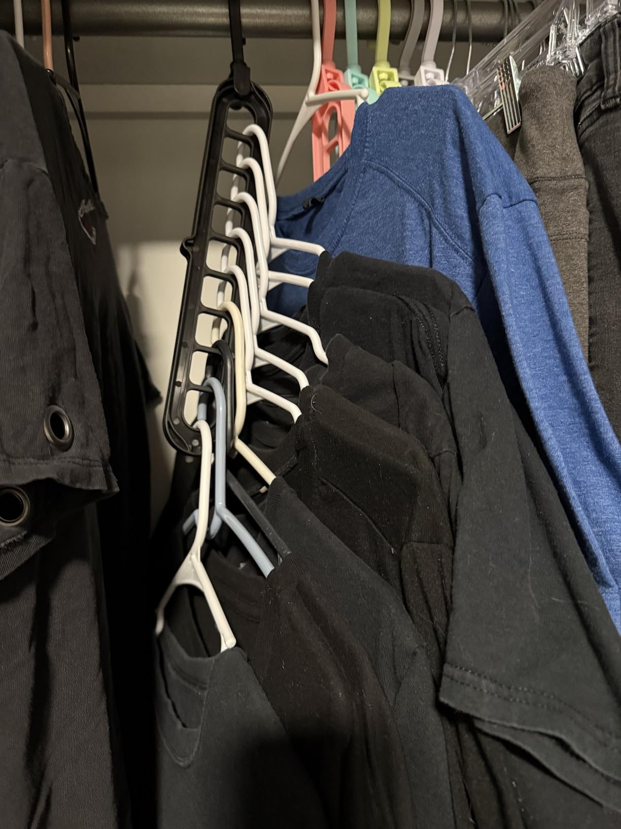 Customer closet organized with black space saving hanger