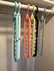 Multicolor space saving hangers hanging in closet