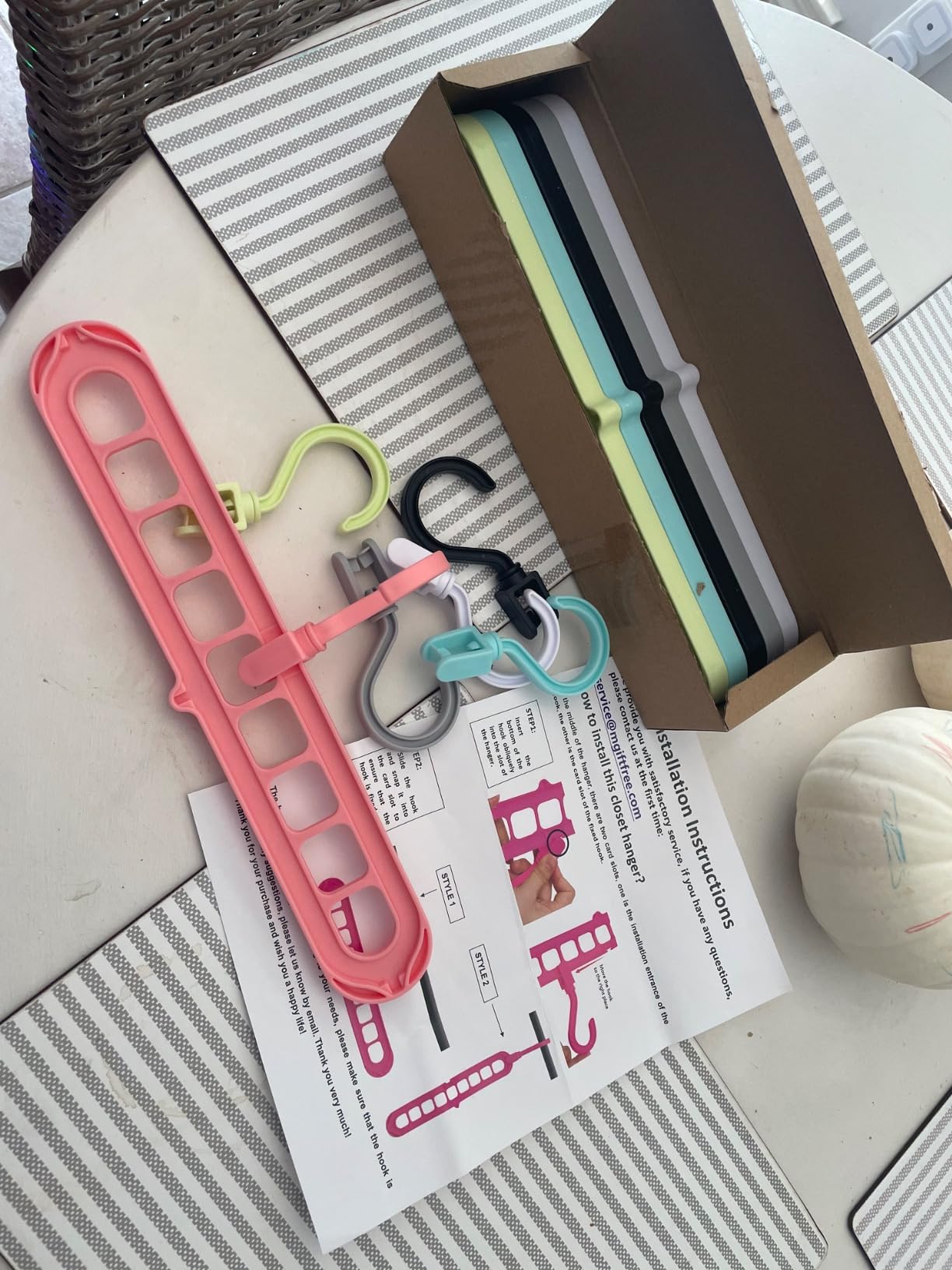 Space saving hangers package with instruction manual